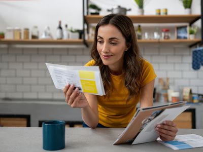 Woman looking at bills